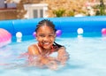 Beautiful black girl swim in swimming pool water