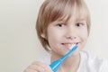 Cute smiling boy brushing his teeth with toothbrush Royalty Free Stock Photo