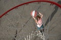 Cute smiling boy plays with basket ball. Cute little boy child in basketball uniform jumping with basket ball for shot Royalty Free Stock Photo