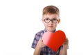 Cute smiling boy with a valentine in the hands of