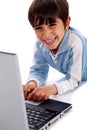 Cute smiling caucasian kid with laptop Royalty Free Stock Photo