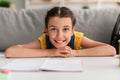 Cute Smiling Girl Posing At Camera Sitting At Desk