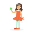 Cute smiling girl in red dress eating green apple, colorful character vector Illustration Royalty Free Stock Photo