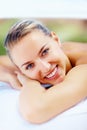 Cute smiling lady at a dayspa relaxing for a beauty treatment. Closeup of a cute woman in a health spa getting ready for Royalty Free Stock Photo