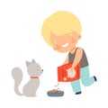 Cute Smiling Little Boy Feeding His Kitten, Adorable Kid Caring for Animal Cartoon Vector Illustration Royalty Free Stock Photo