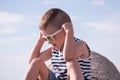 Cute smiling little boy wearing sunglasses and shirt Royalty Free Stock Photo
