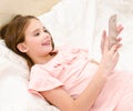 Cute smiling little girl child with her mobile phone smartphone Royalty Free Stock Photo