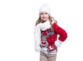 Cute smiling little girl with curly hairstyle wearing knitted sweater, scarf, hat and gloves isolated on white background. Royalty Free Stock Photo