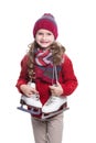 Cute smiling little girl with curly hairstyle wearing knitted sweater, scarf, hat and gloves with skates isolated on white Royalty Free Stock Photo