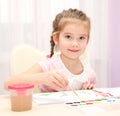 Cute smiling little girl drawing with paint Royalty Free Stock Photo