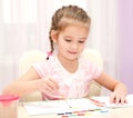 Cute smiling little girl drawing with paint Royalty Free Stock Photo