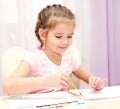 Cute smiling little girl drawing with paint Royalty Free Stock Photo