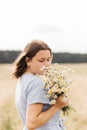 Cute smiling little girl with flower wreath on the meadow. Portrait of adorable small kid outdoors Royalty Free Stock Photo