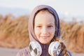 Cute smiling little girl headphones outdoor on beach. Family walking lifestyle Happy kid in earphones listening to music Royalty Free Stock Photo