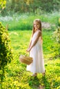 Cute smiling little girl holds basket  with fruit and vegetables at the farm Royalty Free Stock Photo