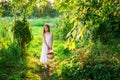 Cute smiling little girl holds basket with fruit and vegetables Royalty Free Stock Photo