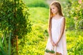 Cute smiling little girl holds basket with fruit and vegetables Royalty Free Stock Photo