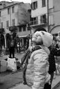 Cute smiling little girl portrait on winter day in the street. Happy children, childhood concept