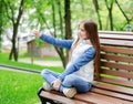 Cute smiling  little girl preteen is taking selfie and using phone smartphone Royalty Free Stock Photo