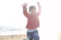 Cute smiling little girl  running on sunny beach, happy little girl Royalty Free Stock Photo