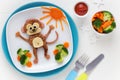 Cute smiling monkey shaped burger with vegetables for kids