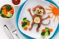 Cute smiling monkey shaped burger with vegetables for kids