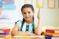 Cute smiling schoolgirl at school