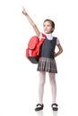 Cute smiling schoolgirl in uniform standing on Royalty Free Stock Photo