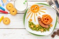 Cute smiling snail made of spaghetti and sausage with peas for kids Royalty Free Stock Photo