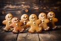 Cute smiling tasty homemade gingerbread men. Delicious cookies on a wooden table Royalty Free Stock Photo