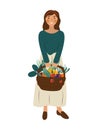 Cute smiling woman in holding basket full of vegetables. Portrait of happy adorable young girl gardener Royalty Free Stock Photo