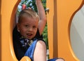 Cute, Smiling Young Boy on Playground Equipment Royalty Free Stock Photo