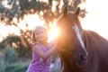 Cute smilling little girl with her handsome horse Royalty Free Stock Photo