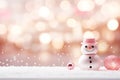 A cute snowman on blurred peach fuzz background. Winter holiday banner for Christmas greetings, announcements or Royalty Free Stock Photo