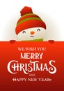 Cute snowman stands behind red signboard advertisement banner with text Merry Christmas and Happy New Year Royalty Free Stock Photo