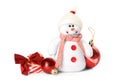 Cute snowman toy, candies and red Christmas balls isolated on white Royalty Free Stock Photo