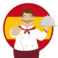 Cute spanish chef with big mustache holding a tray and giving thumbs up over Spain flag Royalty Free Stock Photo