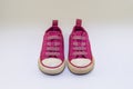 Cute sparkly pink kids shoes with laces , front view