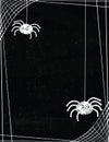 Cute Spiders Hanging off a Web Border on a Chalkboard Background Royalty Free Stock Photo