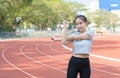 Cute sport woman stretching warm up before running