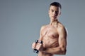 cute sporty man with dumbbells in hands cropped view muscular body Royalty Free Stock Photo