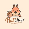 A cute squirrel holds a nut. Nut shop logo or mascot. Cute wild animal Royalty Free Stock Photo