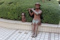 Cute statue of girl playing flute and dog Tokyo Japan