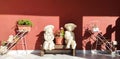 a cute statue at noon is standing under the sun rays in the garden near the house Welcome and home decoration concept.