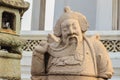 Cute stone of Chinese arts statue in Wat Suthat Temple, Bangkok, Thailand.