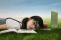 Cute student sleeping on the grass Royalty Free Stock Photo