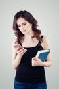 Cute student woman with smartphone texting. Girl cell phone Royalty Free Stock Photo