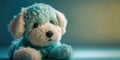 Cute stuffed animal blue puppy dog. Teal background cuddly plush. Adorable children\'s baby toy. Royalty Free Stock Photo