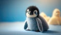 Cute stuffed animal penguin. Blue background cuddly plush. Adorable children\'s baby toy.