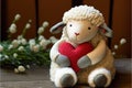 Cute stuffed animals for valentine\'s day. Adorable sheep stuffed animal hugs red heart. Generative AI